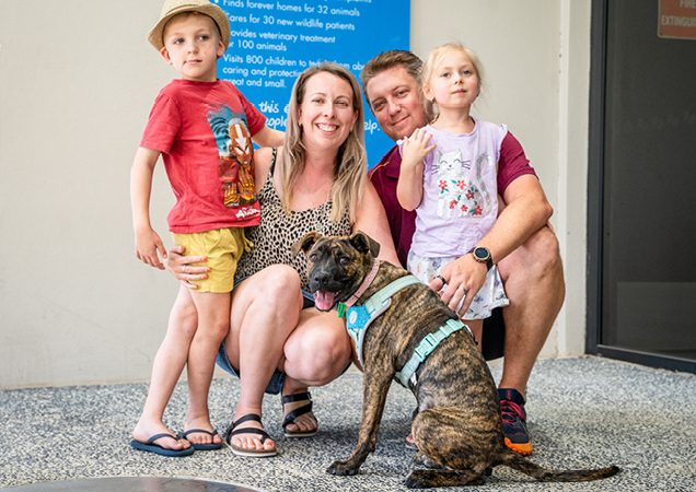 Roo with her new family and foster carer Nadia.